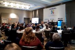 Audience members engage with our panelists as they gear up for some Q&A.